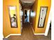 Hallway with decorative mirrors and neutral tones, creating a bright and welcoming transition between spaces at 80 Tanners Ct, Covington, GA 30016