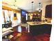 Open concept kitchen with granite countertops flowing into a dining and living space at 80 Tanners Ct, Covington, GA 30016
