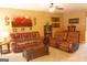Comfortable living room featuring leather sofas, a ceiling fan, and neutral decor at 80 Tanners Ct, Covington, GA 30016