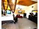 Spacious carpeted main bedroom features a ceiling fan, sitting area and canopy bed at 80 Tanners Ct, Covington, GA 30016
