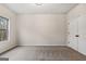 View of empty bedroom featuring beige carpet and double-door closet at 5760 Winding Lakes Dr, Cumming, GA 30028