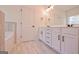 Main bathroom with double vanity and marble-look tile floor at 3278 Greenhill Dr, Villa Rica, GA 30180