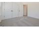 Spacious bedroom with neutral carpeting and double doors at 3278 Greenhill Dr, Villa Rica, GA 30180