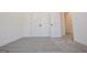 Spacious bedroom with grey carpet and double door closet at 3278 Greenhill Dr, Villa Rica, GA 30180