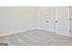 Bright bedroom with grey carpet and double door closet at 3278 Greenhill Dr, Villa Rica, GA 30180