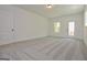 Bright bonus room with grey carpet and exterior access at 3278 Greenhill Dr, Villa Rica, GA 30180