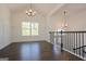 Bright dining room with hardwood floors and a chandelier at 3278 Greenhill Dr, Villa Rica, GA 30180