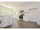 Modern kitchen with white cabinets, stainless steel appliances, and granite countertops at 3278 Greenhill Dr, Villa Rica, GA 30180