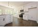 Modern kitchen featuring white cabinets and hardwood floors at 3278 Greenhill Dr, Villa Rica, GA 30180