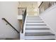 Elegant staircase with dark wood treads and white risers at 3278 Greenhill Dr, Villa Rica, GA 30180