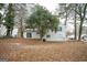 Large backyard with mature trees and plenty of space at 8816 Ashwood Dr, Riverdale, GA 30274