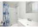 Clean bathroom with a shower/tub combo and updated vanity at 8816 Ashwood Dr, Riverdale, GA 30274