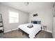 Spacious bedroom with a full-size bed and gray bedding at 8816 Ashwood Dr, Riverdale, GA 30274