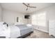 Well-lit bedroom with a ceiling fan and a dresser at 8816 Ashwood Dr, Riverdale, GA 30274