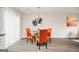 Bright dining area with a round table and orange chairs at 8816 Ashwood Dr, Riverdale, GA 30274