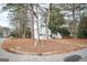 House exterior view on a tree-lined street at 8816 Ashwood Dr, Riverdale, GA 30274