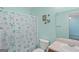 Small bathroom with starfish shower curtain at 103 Odyssey Turn, Conyers, GA 30012