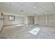 Finished basement with ample space, carpeting, and built-in storage at 6063 Cristie Dr, Ellenwood, GA 30294