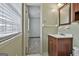 Simple bathroom with vanity, mirror, and window at 6063 Cristie Dr, Ellenwood, GA 30294