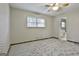 Bedroom with carpet, window, and bathroom access at 6063 Cristie Dr, Ellenwood, GA 30294