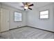 Cozy bedroom with carpet, ceiling fan, and window at 6063 Cristie Dr, Ellenwood, GA 30294