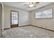 Bright bedroom featuring carpet and window blinds at 6063 Cristie Dr, Ellenwood, GA 30294