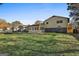 Back of house showing patio, carport, and yard at 6063 Cristie Dr, Ellenwood, GA 30294