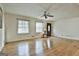 Living room with hardwood floors, neutral walls, and large windows at 6063 Cristie Dr, Ellenwood, GA 30294