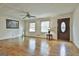 Bright and airy living room features hardwood floors and neutral wall colors at 6063 Cristie Dr, Ellenwood, GA 30294