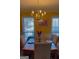 Formal dining room featuring a chandelier and plenty of natural light at 3722 Lockerbie Ln, Powder Springs, GA 30127