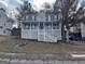 Two story home with a dark roof, porch, white stairs, and dark shutters at 3722 Lockerbie Ln, Powder Springs, GA 30127