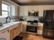 Bright kitchen featuring stainless steel appliances, updated countertops and cabinetry at 3722 Lockerbie Ln, Powder Springs, GA 30127
