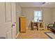 Bedroom with a work area and a comfortable chair, featuring wood laminate flooring and natural light at 2020 Moore Rd, Moreland, GA 30259