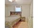 Cozy bedroom features a comfortable bed, wood laminate flooring, and a serene atmosphere at 2020 Moore Rd, Moreland, GA 30259