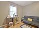 Bedroom featuring a futon, wood floors, and a window with lots of natural light at 2020 Moore Rd, Moreland, GA 30259