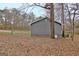 Side view of the house showing the exterior and natural landscape at 2020 Moore Rd, Moreland, GA 30259