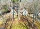 House nestled among trees; view from above at 232 Terrane Rdg, Peachtree City, GA 30269