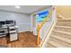 Basement featuring a desk, monitors, drawers, and wooden staircase to the upstairs at 232 Terrane Rdg, Peachtree City, GA 30269