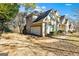 Side view of house showing driveway, garage, and basketball goal at 232 Terrane Rdg, Peachtree City, GA 30269