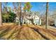 House exterior showcasing a two-story design with a green door and landscaping at 232 Terrane Rdg, Peachtree City, GA 30269