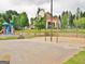 Community playground area featuring a slide, picnic table, volleyball court and basketball court at 232 Terrane Rdg, Peachtree City, GA 30269