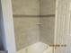 Bathroom with shower and tile surround at 423 Center Sw Cir, Conyers, GA 30094