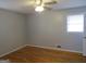Bedroom with hardwood floors and ceiling fan at 423 Center Sw Cir, Conyers, GA 30094