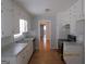 Galley kitchen with white cabinets and gray counters at 423 Center Sw Cir, Conyers, GA 30094