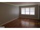 Hardwood floors and gray walls in living room at 423 Center Sw Cir, Conyers, GA 30094
