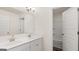 Bathroom featuring double sinks, white cabinetry, and a linen closet at 663 Edgar St # 25, Hampton, GA 30228