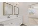 Bathroom features dual vanity with white cabinets, quartz countertops, wood-look floors at 663 Edgar St # 25, Hampton, GA 30228