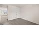 Bedroom featuring neutral carpet, a closet, and an adjoining room at 663 Edgar St # 25, Hampton, GA 30228