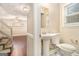 A half bathroom featuring a pedestal sink and tiled floor at 3435 Misty Valley Rd, Decatur, GA 30032