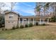 Charming home featuring a covered carport and inviting front porch at 3435 Misty Valley Rd, Decatur, GA 30032